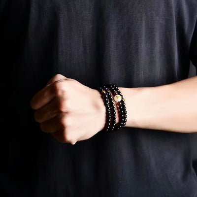 Buddhistisches mala armband mit fluoreszierendem drachensymbol - bracelet